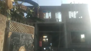 Front of a G+1 house under construction in Ranchi with RCC frame, brick walls, window openings and scaffolding